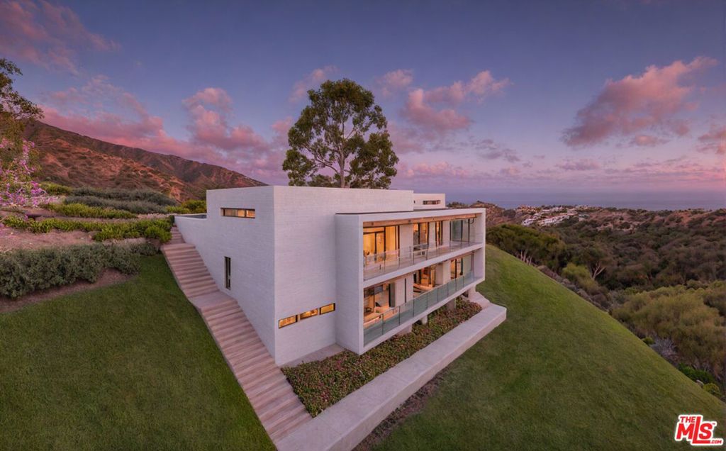 The best land deal in Malibu! 1.19 acres with an ocean view homesite just 3 miles from Pacific Coast Hwy and sandy beaches. This property spans the width of the lush Escondido Canyon, and the homesite offers panoramic mountain views along with a view of the sparkling ocean in the distance. There is excellent access to utilities with water, electricity, and TV/cable all located in the street. At the bottom of the property, a seasonal creek and mature oak trees create an environment of tranquility. There are previously approved plans on file for a modern home by renowned local architect, Vitus Matare, along with extensive previous reports including Geology/Geotechnical soils reports, Survey, and Percolation Tests as well as engineering, landscape, and fuel modification plans. There are also conceptual plans for a luxury prefabricated home by The Home Gallery, giving you numerous options to realize the potential of this property. With coveted views, access, utilities, and extensive previous documentation, this is a rare combination in Malibu priced to sell quickly.