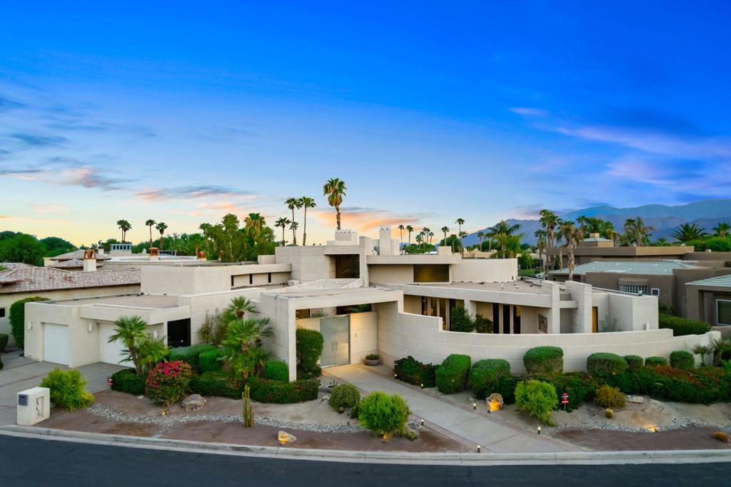 Nestled against the majestic Santa Rosa Mountains, PGA West Paradise offers an extraordinary escape that perfectly blends serenity and elegance. Designed by renowned architect Guy Dreier, this architectural masterpiece features sleek modern glass walls and a signature fireplace, framing breathtaking panoramic views from every room.The primary suite is a private sanctuary, boasting a cozy fireplace, dual-head shower, and a luxurious steam room, offering the ultimate space to unwind and recharge. The expansive living areas showcase picturesque lake and waterfall views, complemented by a seamless indoor-outdoor flow that epitomizes the desert lifestyle.Accommodations include two spacious guest bedrooms with a shared living area, ideal for hosting family or friends, and an office that overlooks a grand courtyard entrance, combining functionality with sophistication.Outside, the property elevates outdoor living with a private putting green, sparkling pool, relaxing spa, and built-in grill, making it perfect for entertaining or enjoying quiet evenings under the desert sky.Situated near world-class golf courses, fine dining, and endless recreational opportunities, PGA West Paradise is more than a home--it's a lifestyle. Don't miss the chance to own this sophisticated oasis. Schedule your private tour today and make this desert dream yours!