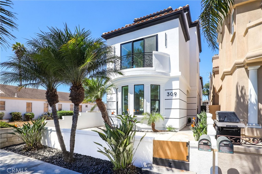 Welcome to this beautifully remodeled three-story home in downtown HB, just three blocks from the beach and minutes from Main Street and Pacific City’s vibrant shops, bars, and restaurants. This 2,992 sq. ft. home offers modern coastal living at its finest. The first floor features an open layout with high ceilings, a spacious living room, and a chef’s kitchen with an oversized waterfall island, custom cabinets, large walk-in pantry, built-in refrigerator, premium Thor appliances—including a 48” range—and a private patio, perfect for entertaining.
The second level has three bedrooms and a versatile bonus room with a beautiful fireplace and soaring ceilings. The primary suite includes a balcony with partial ocean views, spa-like bath with dual vanities, walk-in shower, stone soaking tub, and a custom walk-in closet.
On the top floor you’ll find a loft with a wet bar and rooftop deck, ideal for enjoying the coastal breeze. Additional highlights include central A/C, LVP/wood flooring and large format tiles throughout, and an epoxy-coated two-car garage.
With its prime location, open layout, and luxury upgrades, this home captures downtown HB living at its finest—close to everything you need while offering the privacy you want.