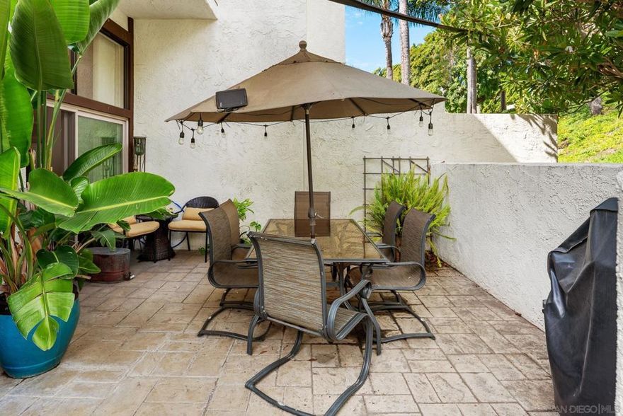Highly coveted end-unit in Vista Del Cerro! Spacious living room with soaring ceilings, gas fireplace, and access to a private patio. Gourmet kitchen with granite counters, stainless steel appliances, and breakfast bar. Upstairs features a primary suite with tall ceilings, ample closets, and a private balcony, plus two additional bedrooms. Gated front patio and attached two-car garage. Community offers park-like grounds, pool, and clubhouse. Walk to highly rated Dailard Elementary and Patrick Henry High School. A true must-see!