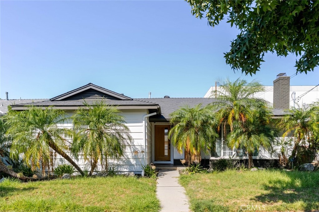 Welcome to 7459 Sylmar Avenue, a beautifully updated single-family home located in the heart of Van Nuys. Offering 3 spacious bedrooms, 2 stylishly renovated bathrooms, and 1,547 sq ft of comfortable living space, this home is the perfect blend of classic charm and modern comfort. Inside, you're greeted by a bright, open floorplan enhanced by soaring beamed ceilings painted crisp white, recessed lighting, and a seamless flow between living, dining, and kitchen areas, ideal for everyday living and entertaining. The updated bathrooms feature elegant tile work, modern vanities, and sleek showers, with one bathroom also offering a luxurious separate soaking tub for ultimate relaxation. Enjoy California living in the private backyard oasis, complete with a covered patio, built-in seating area, and plenty of space for outdoor dining, lounging, or hosting weekend get-togethers. The attached 2-car garage adds convenience and additional storage. Situated on a 5,256 sq ft lot in a desirable neighborhood, this home offers a rare opportunity to own a turn-key property with timeless appeal and thoughtful upgrades.