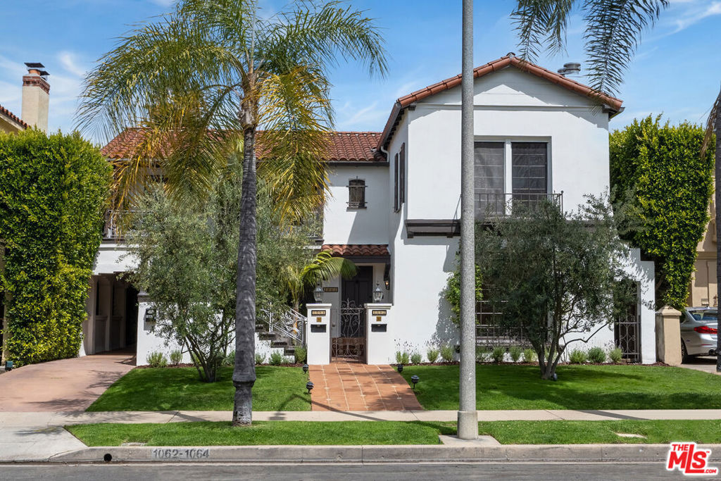 Welcome to a fresh lifestyle offered by this charming three-bedroom, three-bathroom unit situated on a tree-lined street in one of LA's historic neighborhoods, South Carthay, centrally located to all and dubbed one of the city's best kept secrets. This beautiful home offers excellent curb appeal with meticulously manicured landscaping and a grassy front lawn. Inside, the remodeled unit is quite spacious and has been updated with all of the finishes to please the modern tenant. Wide-plank wood floors flow in the light-filled living room with fireplace and leaded picture window framing lush greenery. The updated kitchen includes high-end stainless-steel appliances, an elegant backsplash, ample prep space, and an abundance of cabinetry and storage space. Stackable laundry is located nearby, and the formal dining room is perfect for entertaining. Bedrooms are spacious, and the primary suite features two vanities and oversized shower. Outside, savor al-fresco meals below an enchanting trellis in the shared outdoor dining room appointed with a built-in barbecue amidst plenty of patio lounging space. Enjoy close proximity to Mid-Wilshire's world-class museums and attractions, The Grove, Original Farmers Market, the Beverly Center, and the iconic shopping and dining of Beverly Hills. The 10 Freeway is also nearby, providing access to the Westside and so much more. This is your chance to experience life in Los Angeles as it was meant to be! Available immediately. Note: street parking only.