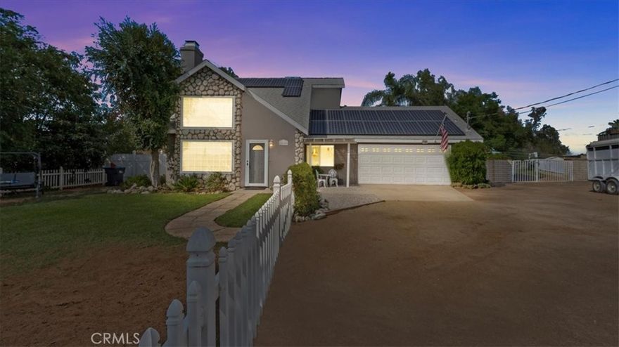 Welcome to this inviting two-story home located in the desirable Woodcrest area of Riverside. With solar, a sparkling pool and spa, and plenty of space for outdoor living, this property blends modern convenience with the warmth of country charm.



Inside, you’ll find a bright and open floor plan with vaulted ceilings, a cozy fireplace, and abundant natural light. The living and dining rooms flow seamlessly together, making it perfect for entertaining. The kitchen features ample cabinetry, tile counters, and a large window overlooking the backyard retreat.



The spacious primary suite is conveniently located on the main floor, complete with direct backyard access and a private ensuite bath. Upstairs, additional bedrooms provide flexibility for family, guests, or a home office, while the loft with built-in shelving makes an ideal study nook or display area.



Step outside to enjoy your private oasis, featuring a recently updated pool and spa, mature landscaping, and multiple seating areas. A built-in firepit and shaded pergola create the perfect setting for barbecues, gatherings, or quiet evenings under the stars.



For horse enthusiasts, the property includes a barn with stalls and a pen.



Additional highlights include:



Solar system for energy efficiency



Oversized two-car garage plus RV and trailer parking



Spacious lot with room for gardening, play, or projects



Mature trees providing both shade and privacy



Set in a sought-after neighborhood with a country feel yet close to shopping, dining, and freeway access, 18680 Dallas Avenue offers the best of both worlds—peaceful living with modern comfort.