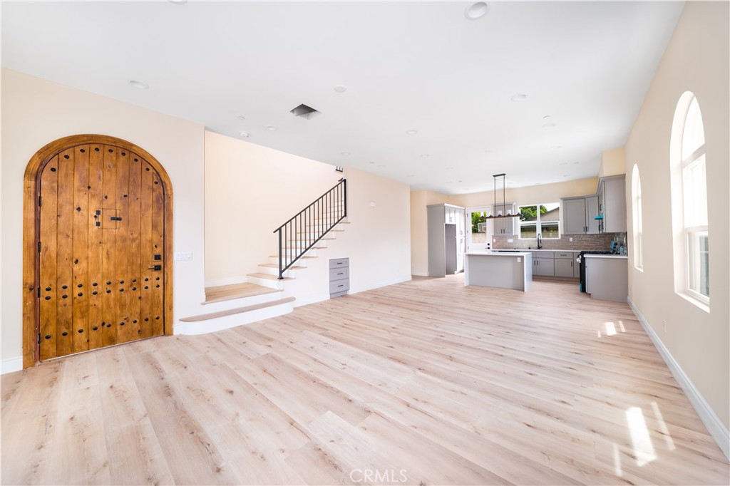 Welcome to 2709 Cogswell Rd, a stunning brand-new Spanish-style detached single-family home located in the heart of El Monte. This thoughtfully designed 4-bedroom, 4.5-bathroom residence features en-suite bathrooms in every bedroom, a spacious open-concept layout, and upgraded finishes throughout. The chef’s kitchen boasts quartz countertops, a full designer water-splash backsplash, and premium cabinetry, flowing seamlessly into light-filled living and dining areas with high ceilings. Enjoy modern comforts with upgraded flooring, recessed lighting, and energy-efficient systems, along with the convenience of a 2-car attached garage and additional guest parking. A private backyard provides the perfect outdoor retreat, while a low monthly HOA adds value without burden. Ideally situated near schools, shopping, and major freeways, this home combines timeless Spanish architecture with contemporary luxury in a prime location.