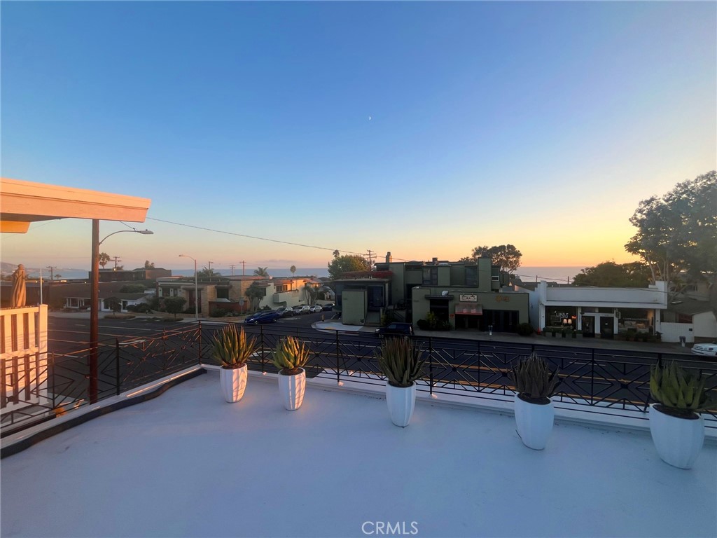 WELCOME TO THIS 3 BEDROOM PENTHOUSE OFFERS PANORAMIC VIEWS OF THE OCEAN FROM THE 800SQFT DECK. This 3 bedroom penthouse has been completely remodeled with unique glass tiles and natural stones. New flooring, sliders and window coverings were also recently installed. Recessed lighting throughout the whole penthouse, fresh paint and has Central A/C. The kitchen is decked out with all stainless steel appliances, quarts counter tops, and marble flooring. Disappearing sliding doors in the living room that face the ocean and open up into a private balcony. Built in glass shelving and faux fireplace to set the mood. Two masters that both open up to a 800 sqft deck with panoramic views of ocean all the way down to main beach. The third bedroom is perfect as a kids room, guest room, office, library, etc.. There is a laundry closet with washer and dryer (provided upon request). Two designated parking spots.