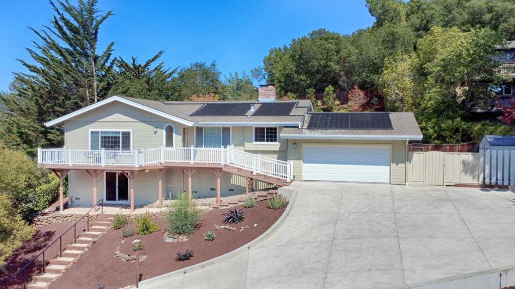 Welcome to this elegant and private view home located in one of the most coveted neighborhoods in Scotts Valley! Perched atop an almost 1/2 acre of beautifully landscaped property, this open and light filled home has views from every room! This meticulously maintained home lives like a single level, with 3 bedrooms and 2 baths on the main floor and a bonus room downstairs, perfect for a home office or a hang out space. Updated throughout with gorgeous Australian chestnut floors, tile, solid maple doors & trim, recessed lighting, beautiful crown molding as well as granite countertops, real wood cabinets and high end, stainless steel appliances in the kitchen. The formal living room opens up to the fully fenced and stunning resort style backyard, with mature landscaping, terraced flagstone patio and custom, in ground, sparkling Pebble Fina swimming pool with waterfall. Add in an additional fenced off grassy area, perfect for gardening or a play structure, and you have a property that absolutely checks all the boxes! Whether you enjoy sunbathing, pool parties, intimate sunset gatherings or just quiet family/solo time, this terrific home is what you have been waiting for. Do not miss this amazing opportunity!