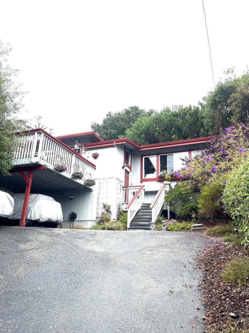 Welcome home! Your opportunity to live in Costal Aptos between Seascape and Seacliff and everything they have to offer is right here. Conveniently located near beach path access. The home has 2 Beds & 2 Baths on the same level as the Family Room and Kitchen, all perched above the parking and driveway. Sun kisses the front of the home in the afternoon including the large balcony deck off the kitchen featuring a unique feature for cat lovers - a custom "Cat-io" protected cat run accessible from the eat-in kitchen through a window screen. These same front windows have Silhouette pull-down shades to give you the option of how much sun you let in. Family Room features a vaulted exposed beam ceiling, half-height plantation shutters, gas fireplace with electric blower and wood floors. The grounds of the property include mature landscaping, a drip watering system, a French Drain to maintain water flow, a water feature in back yard outside Primary Bedroom and a back up generator down in carport next to the large unfinished storage area under the home.