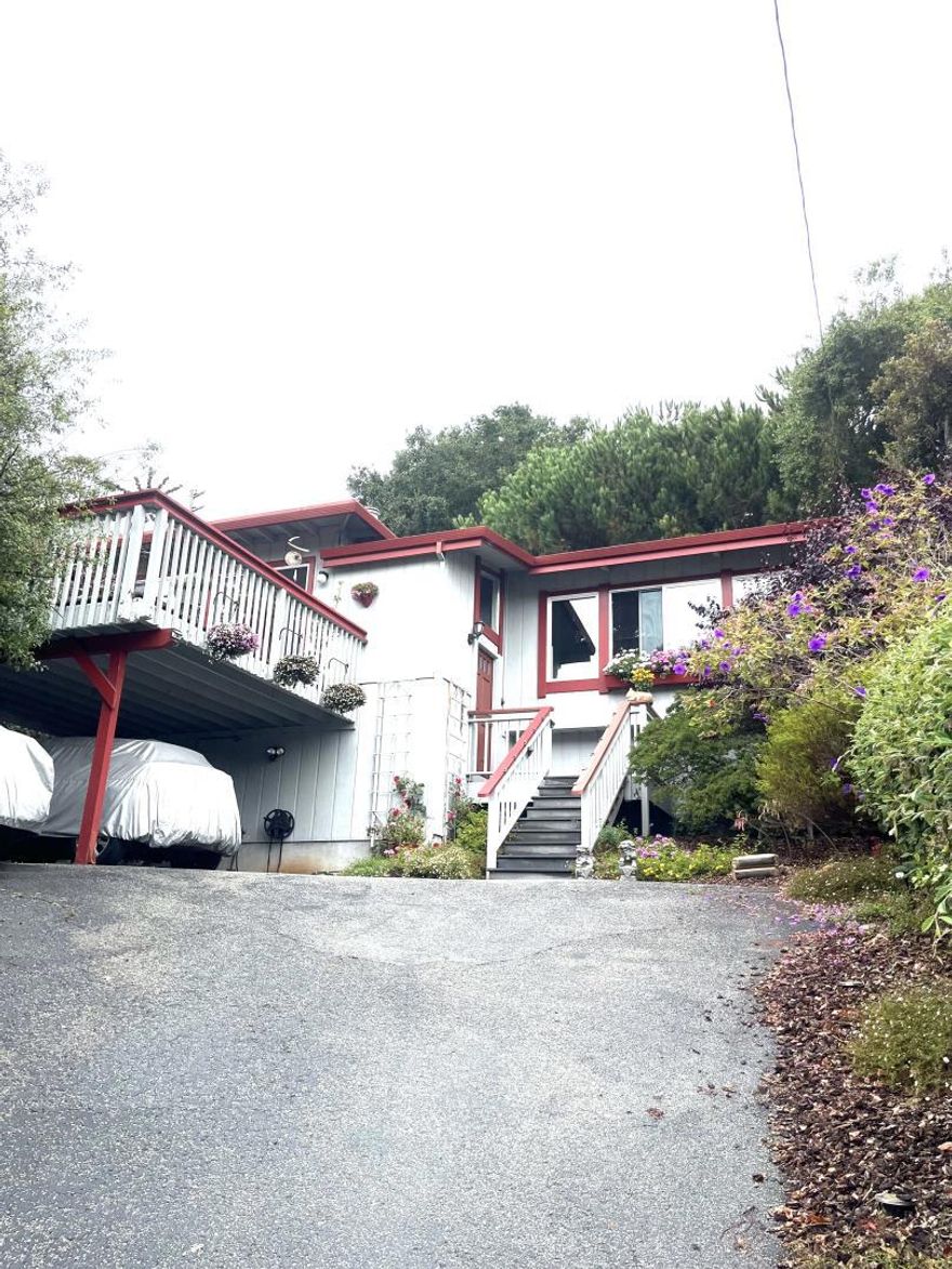 Welcome home! Your opportunity to live in Costal Aptos between Seascape and Seacliff and everything they have to offer is right here. Conveniently located near beach path access. The home has 2 Beds & 2 Baths on the same level as the Family Room and Kitchen, all perched above the parking and driveway. Sun kisses the front of the home in the afternoon including the large balcony deck off the kitchen featuring a unique feature for cat lovers - a custom "Cat-io" protected cat run accessible from the eat-in kitchen through a window screen. These same front windows have Silhouette pull-down shades to give you the option of how much sun you let in. Family Room features a vaulted exposed beam ceiling, half-height plantation shutters, gas fireplace with electric blower and wood floors. The grounds of the property include mature landscaping, a drip watering system, a French Drain to maintain water flow, a water feature in back yard outside Primary Bedroom and a back up generator down in carport next to the large unfinished storage area under the home.