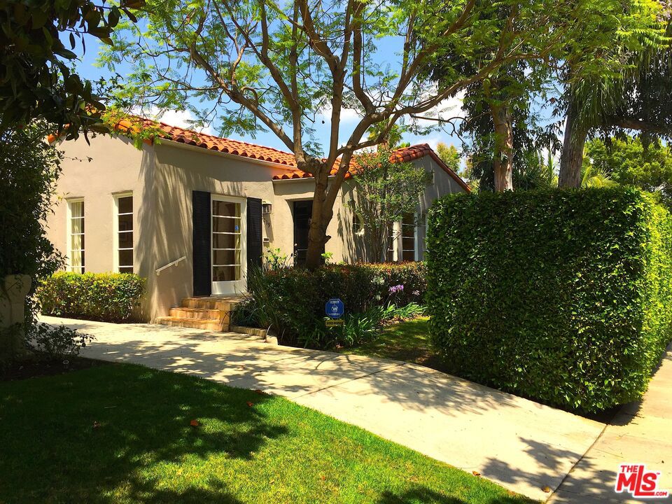 Charming Private Spanish villa located in one of West Hollywood's most desirable neighborhoods. This 3 bedroom, 2 bath home features a spacious kitchen with separate breakfast room, formal dining area, beautiful hardwood floors, separate laundry room with washer/dryer. The private backyard has large grassy area, outdoor dining space and patio. There's a long driveway for excellent on-site parking. Conveniently located near all the best boutiques, restaurants and shops that Robertson, Melrose and Beverly have to offer. Available for immediate move-in.