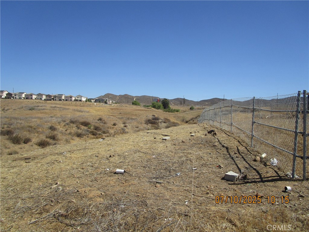 PRICE SHARPLY REDUCED by motivated seller -- BELOW recent nearby comparable sales. SELLER FINANCING also available for qualified buyer. Great views. Over 60' frontage on deep over 100' COLE AVE irregular lot near intersection with Avenue 6, just above Mill Street, Lake Elsinore. Lake Elsinore Zoning Map has re-zoned this R-1 lot as RMU - Residential Multi Use; allows for great flexibility (mobile home or other dwelling per Lake Elsinore rules). Buyer and Buyer's agent to review Lake Elsinore and Riverside Zoning regulations and verify acreage, boundaries, potential usage, permits utilities, easements, rights of way, building requirements, zoning, and all details with City of Lake Elsinore and/or Riverside County. All info herein deemed reliable but not guaranteed. All Offers considered quickly.