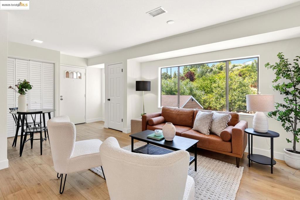 Discover this rare 2-bedroom, 1-bathroom carriage house-style condo offering the privacy of a detached home—no shared walls, no neighbors above or below. Tucked away in a quiet community, this light-filled unit combines comfort and convenience in one desirable package. Enjoy easy freeway access for quick commuting, and take advantage of being just minutes from downtown Martinez, local shopping, dining, a movie theater, and more. Whether you're a first-time buyer or downsizing, this home is a must-see!