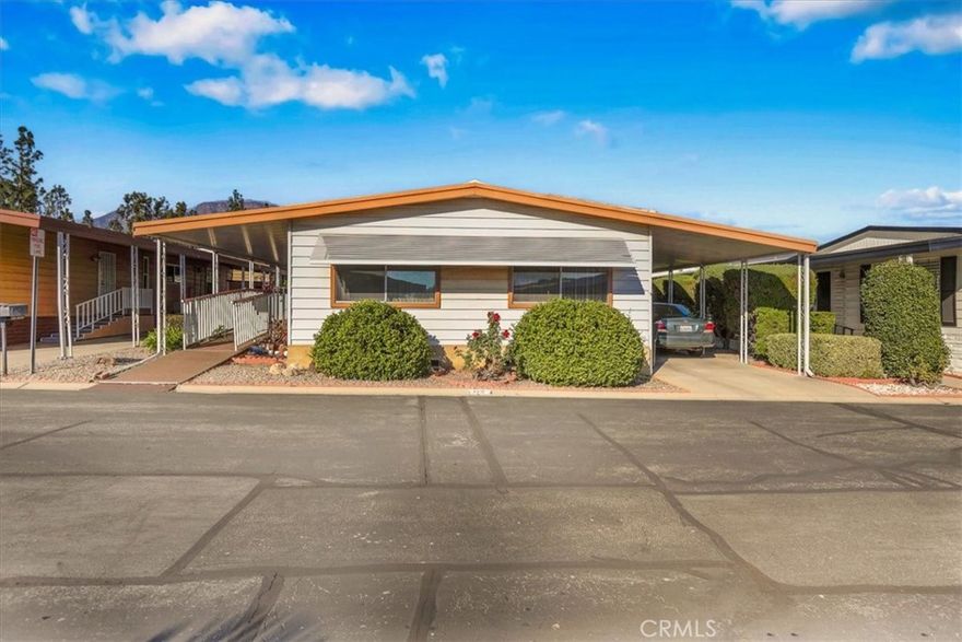 Welcome to this charming 2-bedroom, 2-bath, 1,344 sq ft home located in a beautifully maintained 55+ senior community. This spacious residence features a bright living room, a large dining area with built-in cabinetry, and a well-appointed kitchen with plenty of storage. The living room has been professionally reinforced to support the weight of a full-size pool table, making it perfect for entertaining or enjoying your favorite hobbies.

The home also offers a covered carport, indoor laundry, and a low-maintenance yard with mature fruit trees. Clean, comfortable, and full of potential—this home is ready for its next owner to make it their own.