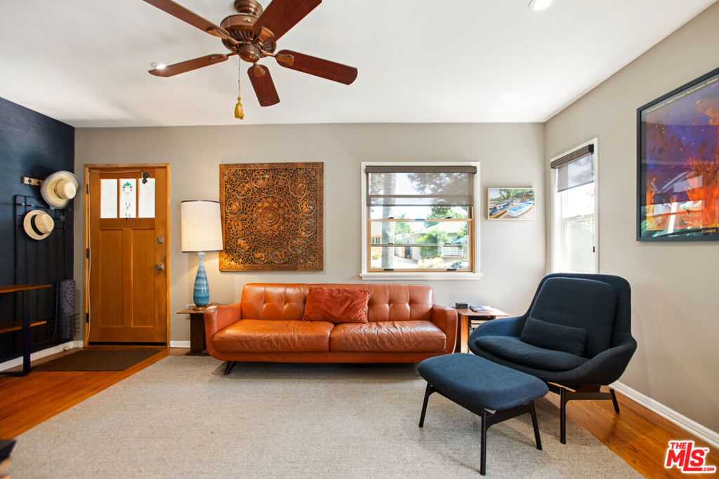 This charming, fully furnished three-bedroom, one-bathroom home in Picfair Village offers the perfect blend of comfort, convenience, and style in one of Los Angeles' most central neighborhoods. Inside, you'll find a sun-filled and thoughtfully furnished living room, with many pieces having been handcrafted by the owner. The kitchen, with warm wood tones, green tiled accents, and updated appliances is ideal for cooking cozy weeknight meals or hosting friends for dinner. A stacked washer and dryer are tucked neatly into a laundry closet, adding extra convenience for day-to-day living. Step outside to a private backyard featuring a Weber grill and plenty of seating, perfect for relaxing or entertaining. Nestled on a quiet street just minutes from Culver City, Beverly Hills, West Hollywood, and Miracle Mile, this home combines the peaceful charm of Picfair Village with easy access to LA's best cafes, shops, and local favorites. This rental is offered for a one-year lease starting November 1, 2025, with all utilities included, making city living effortless for traveling professionals, short-term assignments, or anyone seeking a stylish, turnkey home for their year in Los Angeles.