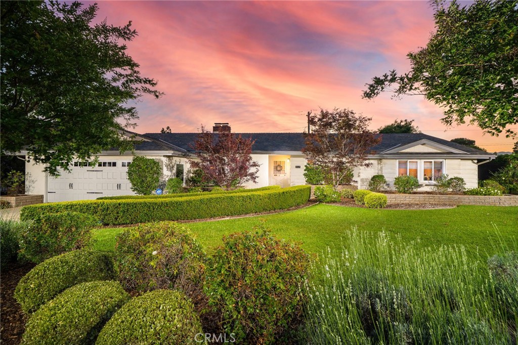Located in one of Claremont’s most sought after neighborhoods, this beautifully designed home is custom-built and offers convenient access to local shops and schools. From the moment you arrive, the home impresses with its striking curb appeal and professionally designed landscaping. The two-car attached garage is seamlessly integrated into the home’s exterior design. Inside, hardwood floors and natural light create a warm, inviting atmosphere throughout. The expansive living room at the heart of the home, with large windows and a stone fireplace enhancing the space. Flowing into the generous dining area, this layout is ideal for both everyday living and entertaining. Just off the living room, an additional room features beautiful backyard views, an ideal setting for a home gym, reading nook, or private office. A separate family room, complete with its own fireplace, offers additional comfort for casual lounging. The kitchen is well-appointed with ample counter space, custom cabinetry, and stainless steel appliances. It provides easy access to a powder room and laundry/mudroom which leads directly to the backyard, providing convenient access from the swimming pool. On the opposite side of the home, you’ll find four well-sized bedrooms and three more bathrooms. The primary suite is a standout, featuring direct access to the backyard and a recently updated en suite bathroom with dual sinks and a beautifully finished walk-in shower. An additional bonus room off the primary suite offers the perfect space for a second home office, or private retreat. Thoughtfully designed and rich in character, this home combines comfort, style, and versatility, making it a truly beautiful place to call home. The backyard is a beautifully designed outdoor space that offers the perfect balance of comfort and function. A sparkling pool serves as the centerpiece, surrounded by generous open areas ideal for both entertaining and unwinding. Whether you’re hosting gatherings, enjoying quiet evenings, or lounging poolside on a sunny afternoon, this space provides flexibility and charm. The seamless transition from the interior to the backyard from three rooms enhances everyday living and creates a natural extension of the home. This inviting atmosphere serves as a private retreat adding to the overall elegance and livability of the property.