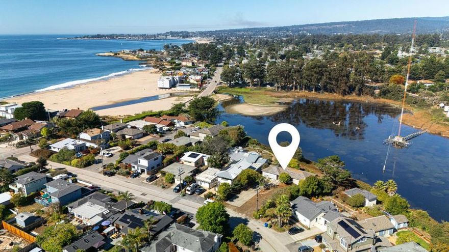 Prime opportunity to build your dream home on a rare, expansive lot of approximately 17,000 sqft, fronting a tranquil lagoon (no back fence or neighbor). Located on the ultra-quiet and sought-after 24th Avenue, less than 10 houses from the sand. The existing structure is a total teardown, presenting a blank canvas to create the estate or family compound of your dreams. Design a one-of-a-kind custom home on this unique parcel, offering space, privacy, and unbeatable location. Perfectly positioned between the Santa Cruz Yacht Harbor and Capitola, close to Pleasure Point surf breaks, 41st Avenue's shops and restaurants, and miles of scenic coastline. Rarely do parcels of this size, fronting a lagoon, come on the market. Own a legacy property on one of the best streets in Santa Cruz.
