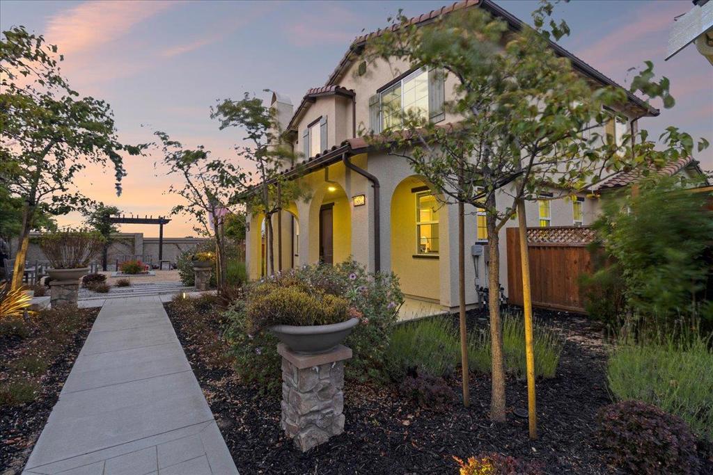 Experience modern luxury and thoughtful design in this impressive 4-bedroom, 3.5-bath home that showcases over $100k in premium upgrades, blending sophistication with everyday comfort. Enjoy the peace of mind and savings that come with fully paid-off solar and a dedicated EV charging station-ideal for today's energy-conscious lifestyle. The 3-car garage provides abundant space for vehicles, storage, and hobbies. Perfect for flexible living, this home features en suite bedrooms on both the main level and upstairs, offering privacy and convenience for guests or multi-generational living. The chef's kitchen offers premium Italian-made Bertazzoni appliances and is highlighted by an oversized island, providing both exceptional quality and a spacious area for cooking and entertaining. Upstairs, a convenient laundry room with built-in cabinetry adds to the home's functionality. Bird netting has also been professionally installed under the eaves and around the solar panels, offering a humane and effective solution to keep birds away while preserving the property's cleanliness and appearance. The open-concept living and dining areas create a warm, connected environment, offering plenty of space to relax and entertain with ease.