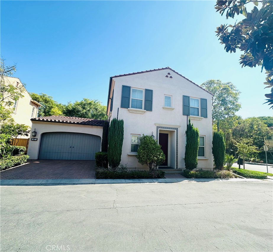 Gorgeous 3 bedroom plus a den, 2.5 bath detached home within Irvine's Village of Woodbury. After arriving through the entry foyer, your guests will be amazed at the expansive great room, kitchen and nook area. This open floorplan is the entertainer's delight. The spacious great room with a cozy fireplace. Adjacent to the foyer is a home office area or it can be used for a formal dining room if you prefer. The gourmet kitchen features granite kitchen countertops and stainless steel appliances with a 5 burner cooktop and dishwasher. There is a privately located den on the first level which can be used as a 4th bedroom. Upstairs you will find two secondary bedrooms with a full bath. The ample Master Suite features coffered ceilings and crown molding. There is a large walk-in closet and the master bath has a separate soaking tub and large stall shower. Plantation shutters and hardwood flooring throughout. Private backyard includes trellis and gas stub for barbecue. Great corner location, steps away from Woodbury Elementary School and The Commons, Woodbury's 30-acre recreation area with pools, tennis courts, community park, sports fields and more! Enjoy 16 neighborhood parks and gardens, 7 swimming pools, basketball courts, tot lots, and tree lined streets. You are also just a short walk to The Woodbury Town Center with shopping, restaurants & more!