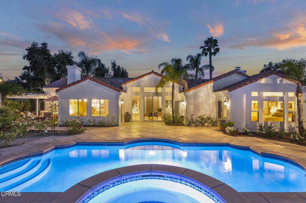 Luxurious Spanish-style living in a private Ojai setting. Welcome to 1454 South La Luna Avenue, designed with a contemporary interpretation of Spanish Mission-style architecture by the well-known and highly respected architect Barry Berkus. This home offers a seamless blend of indoor and outdoor living. Set behind privacy hedges at the end of a quiet cul-de-sac, the property offers a tranquil retreat just minutes from downtown Ojai. Step through the dramatic entry courtyard into a spacious single-story layout offering approximately 2,476 square feet of light-filled living. Vaulted ceilings in both the living and family rooms enhance the open feel, while large glass doors and tall windows throughout invite seamless indoor-outdoor living. Nearly every room connects to a patio, garden, or the stunning pool area, ideal for entertaining or quiet reflection. The layout features three bedrooms and two and a half bathrooms, with all bedrooms situated on one side of the home. A formal dining room off the entry adds to the home's thoughtful flow. The kitchen is a designer's dream, fully renovated and beautifully appointed. It is a space any gourmet chef will love, with high-end finishes and effortless flow into the family room and outdoor dining areas. Light wood floors and tasteful updates throughout reflect the quality of the renovation completed within the last decade. Outdoors, enjoy a resort-style experience with a sparkling pool and spa, surround sound speakers, a well-equipped outdoor cooking area with built-in grill, sink, and mini fridge, a cozy fireplace, meandering pathways, fruit trees, and multiple private sitting areas that offer both sun and shade. The detached three-car garage adds convenience and flexibility. When you are not relaxing at home, stroll just down the street to pick up fresh-baked bread at the neighborhood bread stand or stop by the nearby fruit stand for locally grown fruits, vegetables, and fresh-cut flowers. Bring your bounty back to the beautifully renovated gourmet kitchen, where you will love preparing meals with seasonal ingredients in a space designed for both creativity and connection. South La Luna is a rare combination of luxury, privacy, and the authentic Ojai lifestyle. Whether you're downsizing, upgrading or searching for a peaceful retreat, this is a home you will treasure.