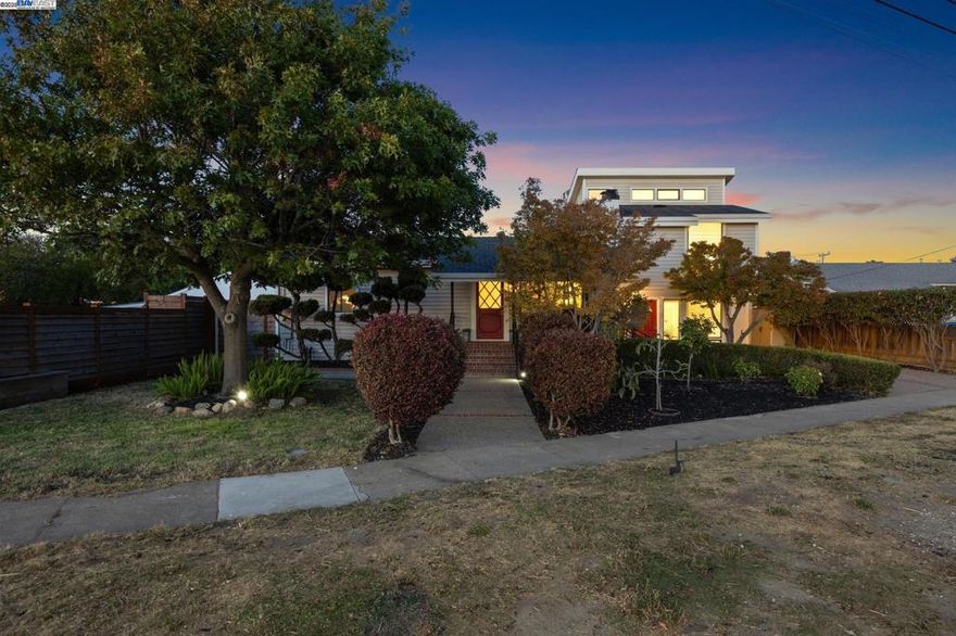 Originally built in 1920 on Alameda’s Bay Farm Island, this charming 3BR/2BA home combines classic character with modern versatility. In the 1980s, a spacious in-law addition was added, featuring a family room, kitchenette, large bedroom, and full bath. With its own private entrance and driveway, it’s ideal for extended family, guests, or an au pair.  The original residence offers 2BR, 1BA, a formal living room with fireplace, and an open dining/kitchen area recently remodeled with quartz counters and new appliances. Beautifully landscaped front and back yards frame the home, with a large redwood deck off the dining room providing the perfect space for entertaining. A detached garage adds flexibility as a home office, gym, or potential ADU.  The large lot provides parking for up to 10 cars. Solar panels with a power-sellback agreement to Alameda Power deliver exceptional energy efficiency and an extremely low electric bill—live nearly off the grid!   Located near Bay Farm’s top-rated schools, Safeway, Godfrey Park, shoreline, and Oakland Airport, with easy access to the SF Ferry, AC Transit OX bus, and freeways. Pride of ownership shines throughout this special home. Some photos digitally enhanced for marketing purposes.