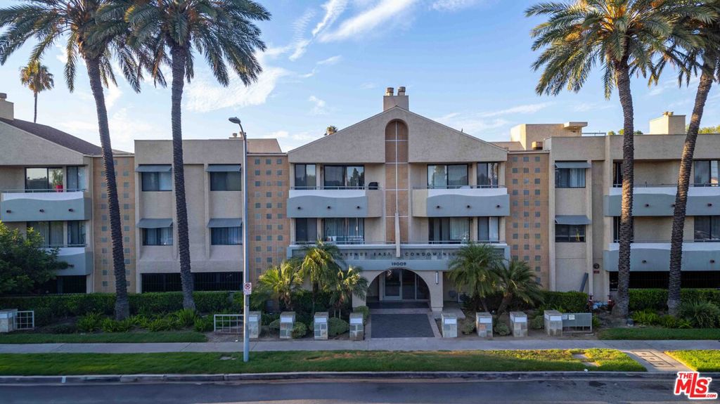 Corner unit in the back of the building with a private gated 2-car garage! This stylishly updated 2-bedroom, 2-bathroom condo in Winnetka is tucked away in one of the most desirable gated communities along Sherman Way, offering both privacy and convenience. The bright, spacious open-concept living area features a cozy fireplace and direct access to a private balconyperfect for morning coffee or evening relaxation.The recently remodeled kitchen includes brand-new stainless steel appliances, sleek countertops, and an upgraded sink, providing a fresh and functional space for everyday living or entertaining. Both bedrooms are generously sized with abundant natural light and ample closet storage.Additional highlights include in-unit laundry, central A/C and heating, and the rare benefit of your own private 2-car garage with gated access, located at the back of the building for added privacy.Residents of this highly sought-after community enjoy resort-style amenities including a sparkling pool, spa, and well-maintained common areas. Conveniently located near shopping centers, schools, restaurants, and major freeway access, this condo offers the perfect blend of comfort, style, and location.