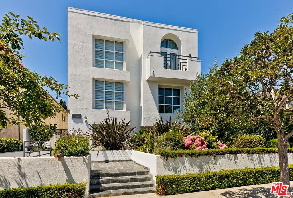 Welcome to this beautifully designed and recently remodeled, rare front-unit townhome in an intimate 4-unit building, ideally located in the heart of Santa Monica. Bathed in natural light and with numerous windows placed to provide privacy, this 2-bedroom, 2.5-bathroom home also features a versatile loft perfect as a den, home office, playroom, or creative space. Thoughtfully updated throughout, the townhome offers soaring ceilings, a renovated kitchen with modern finishes and ample storage, stylishly remodeled bathrooms, and warm wood flooring in every room. The open-concept living, dining area, and multiple private outdoor spaces are ideal for entertaining, while the upstairs bedrooms offer comfort and privacy. Additional conveniences include large capacity in-unit washer and dryer, two dedicated parking spaces and storage area, security features, two flat screen TVs, and a prime location just a stone's throw from Santa Monica's best grocery stores, coffee shops, and restaurants. Don't miss this opportunity to live in a bright, elegant and modern home in one of Santa Monica's most desirable neighborhoods.