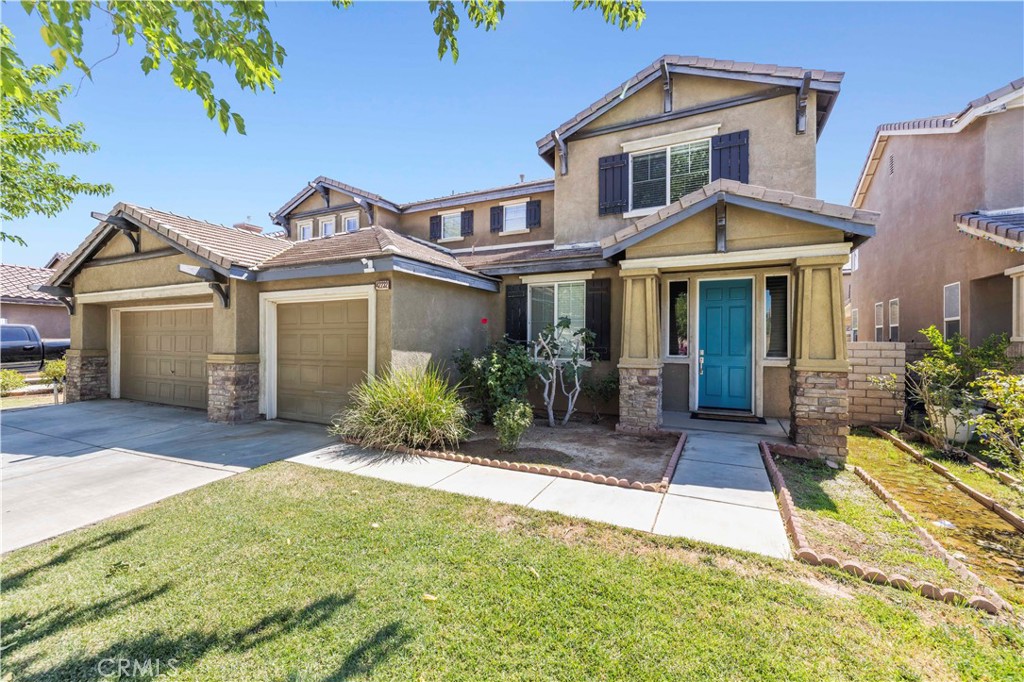 Spacious Quartz Hill home featuring 7 bedrooms, including 2 on the main level, and 3 full bathrooms. The open-concept kitchen flows into the living area with a built-in entertainment niche, perfect for everyday living. Additional highlights include a 3-car garage, laundry room, recessed lighting, and a paved back patio ideal for outdoor gatherings. The primary suite offers a generous walk-in closet, soaking tub, separate shower, and an extended dual vanity.