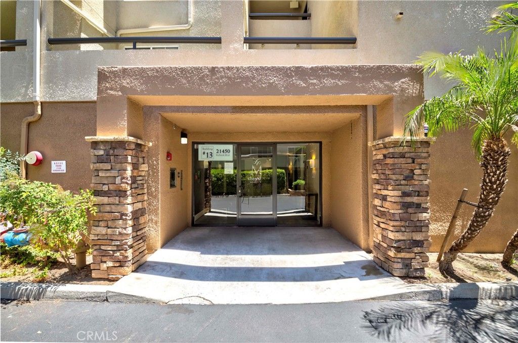 Photo of 21450 Burbank Boulevard #211, Woodland Hills, CA 91367 (MLS # RS25149853)