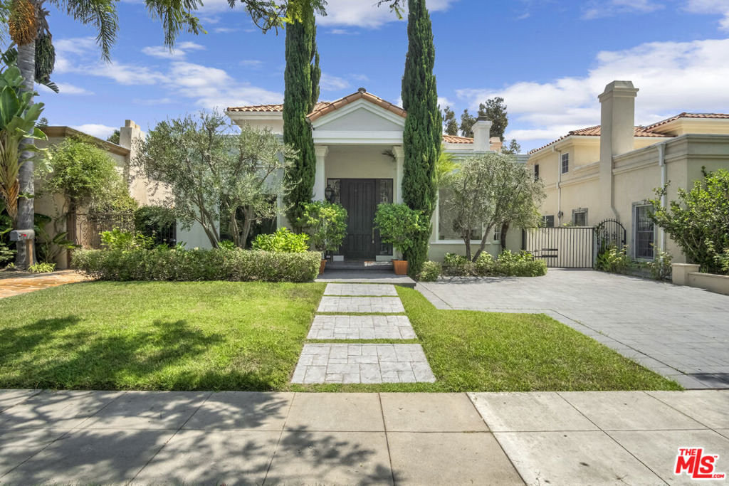 This meticulously renovated 3,944 sq. ft. two-story residence, nestled on a serene, tree-lined street, is a harmonious blend of modern elegance and functional luxury, offering 5 bedrooms and 6 bathrooms with soaring high ceilings and abundant natural sunlight that creates an inviting, airy atmosphere. Thoughtfully designed with premium finishes, the home features an expansive open-concept layout with solid hardwood floors, LED lighting, and large windows that bathe the interiors in natural light, alongside a state-of-the-art gourmet chef's kitchen equipped with stainless steel appliances, dual sinks, dual ovens, a grand island with bar stool seating, and a cozy breakfast area that flows effortlessly into the interconnected dining and living spaces. Stone countertops, a wet bar, and a dedicated laundry room elevate daily living, while two-zone central A/C and heating ensure personalized comfort, complemented by ample storage with multiple walk-in closets and linen spaces. The property includes a lush, grassy private yard perfect for relaxation or entertaining, a detached garage, and a long driveway for ample parking. Located in a quiet, safe, and walkable community, this home offers the perfect balance of tranquility and accessibility, with proximity to Trader Joe's, Ralphs, CVS, Target, schools, banks, parks, and hospitals, and easy access to the 405, 101, and 10 freeways, placing you just minutes from everything the city has to offer. The landlord covers gardening services, with tenants responsible for all other utilities. This exceptional residence is a rare find, blending modern sophistication with a warm, welcoming ambiance in an unbeatable location.