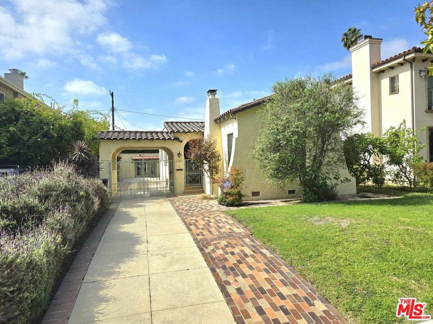 Welcome to a beautifully presereved 1929 Spanish-style home that blends timeless character with modern comfort in one of west LA's most desirable neighborhoods. Step through the arched doorway into a warm, sun-filled interior featuring original hard wood floors, coved ceilings, wrought-iron accents and classic architectural details that capture the romance of early Los Angeles. The spacious living room centers around a stunning picture window and a cozy fireplace. The formal dining room opens seamless to a charming kitchen with a breakfast nook. Both bedrooms are generously sized with primary suite offering a private half bath and a walk-in closet. Rear deck extending from the kitchen offers entertaining and family gathering possibility. The property also features a converted garage recreation room with a closet, ideal for use as a home office, studio or guest space with the probability of a future ADU. The spacious backyard provides endless potential for entertaining, gardening, or future expansion. Enjoy the best of Westsdie living - just minitures from the new UCLA Research Park, Sawtelle dining, Century City, UCLA and the beaches of Santa Monica.