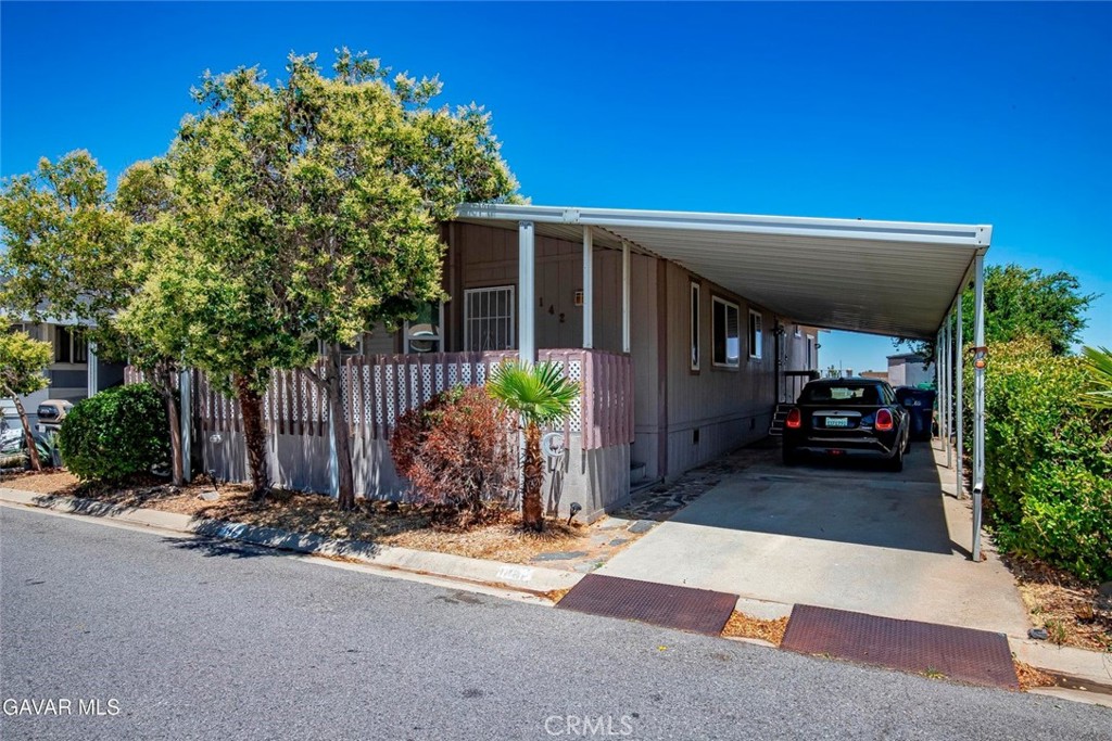 GREAT RARE 3 BEDROOM, 2.5 BATH HOME IN BOULDERS I. This Rancho Vista Park is very well maintained and has a guarded gate for security. And the home has been nicely upgraded. The Spacious Living Room has High Ceilings for an open, contemporary feel and a Cozy Fireplace with Glass Tile Surround. The Kitchen was remodeled with Rich Granite Countertops with decorative Backsplash. There is a roomy Dining Area great for the family and entertaining. You'll really appreciate the Half Bath at the front of the house! The Master is roomy with a Walkin Closet and a Ceiling Fan. There is custom tile counter on the master vanity. The Indoor Laundry Room has Lots of Cabinets and will include the Washer and Dryer. All flooring is Solid Surface--Laminate Wood or Tile. The Roof was replaced less than 10 years ago and an electric Sub Panel was added. The Patio is Large for nice outdoor space. All of the park amenities are close by so an quick walk to the pool and kid play area. The shed will stay. Don't miss this nice home which is ready for your family!
