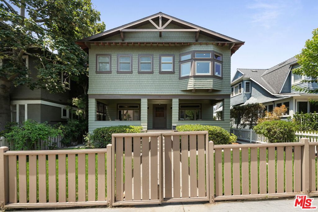 A one-of-a-kind restored 4 bed/3.5 bath Craftsman located on prime Venice walk street with the perfect blend of incredible authentic perioddetails blended with updates and one of the LARGER 5,396sf LOTS in the area. Gated large grassy front yard leads to inviting spacious covered front porch.Oversized living room with wood-beam ceilings, stone finished fireplace, beautiful built-ins and bay window with original stained glass accents. Spaciousformal dining room fits table for 10, opens to updated gourmet kitchen with center island, travertine countertops, stainless steel appliances including 2dishwashers and newer 6 burner range and double ovens. Charming breakfast room with built-in banquette and den/office area all open to entertainer'sback deck and large yard with brick patio, hot tub, fire-pit and built-in barbecue. 4 bedrooms upstairs include spacious primary suite with large walk-incloset and sunny bay window with built-in bench. Primary bath includes double rain shower heads and marble-finished vanity with dual basins. 4thbedroom with vaulted ceiling, 2 closets, built-ins and ensuite 3/4 bath. 4-CAR PARKING, including 2-car garage with auto door and EV charger. Hardwoodflooring throughout, wainscoting wall accents, central ac/heat, all updated bathrooms, wired alarm system. Steps to boardwalk and beach, and ideal closeproximity to trendy Abbot Kinney, Santa Monica Main Street and Marina Del Rey restaurants and retail. Breathtaking sunsets just steps away!