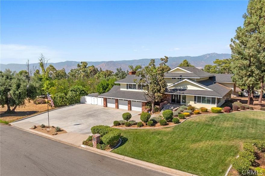 In the Highly Desirable Hills of South Redlands, along scenic Sunset Dr. your new home awaits! Walking distance to Mariposa Elementary and a short golf cart ride to Redlands Country Club, this home offers a comfortable, functional layout that facilitates full enjoyment of your home! {Be sure to read the *photo captions* as you scroll through the photos}. Step through the grand double door entrance to your entry foyer (or step in from your 3 car garage) and head to one of your TWO Living Rooms. Prepare a meal in your gourmet kitchen with wrap around counters, a counter bar and a casual dining space that opens to your lower Living Room; Or enjoy the meal in your formal Dining Room or your fully covered Outdoor Dining patio. Head up the back staircase to find 2 mid-level bedrooms w/ great closets and a full bathroom. Turn the corner to a short staircase leading to your Primary Suite (one of 2 entrances). Look at that view from your room!! The suite also offers 2 separate vanity dressing rooms, each with their own closet and their own door into the shower room. The Upper Living Room (w/ fireplace and beautifully scenic balcony) has direct access stairs down from the Primary Suite and up from the entry foyer. The lower level private bedroom and bathroom (at the back of the house) create the perfect guest room, in-law suite or home office / work studio. The backyard is the perfect place to relax, play & entertain! So much space, a large pool, covered spaces with shade, a playground, a lush greenbelt, a gas-plumbed firepit, and a fresh concrete slab w/ electricity ready to build your workshop, shed or studio. Easy access to bathroom & shower from the pool through your indoor laundry room. Need space for cars and recreational toys? The 3-car garage and huge (drive through style) driveway has room for it all! Desirable schools, beautiful views, parks and a Country Club are just some of what makes this neighborhood so desirable! Tranquil nature surrounds you and yet easy access to the freeway is quick. "Redlands – known in 1900 as 'The City of Millionaires' and later as 'The City of Beautiful Homes' welcomes you! Founded in 1881... Redlands is a quintessential 'big town' with a 'small town' feel". The Historic Downtown, Historic Train Station, Kimberly Crest House & Gardens, The Redlands Bowl Summer Music Festival and a wealth of great parks and trails!! Come see this truly remarkable home!!