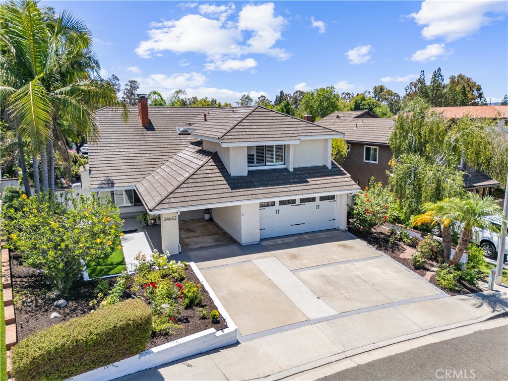 Welcome to this exceptional gem in Laguna Hills, offering the perfect blend of elegance and comfort with over 3000 square feet of living space! This versatile residence features 6 bedrooms or 5 bedrooms with a bonus room, ideal for a variety of living arrangements. The open floor plan includes a main floor bedroom and bathroom with a shower, catering to guests or multigenerational living.
Step into the grand living room where a fireplace and soaring ceilings create a striking focal point. Enjoy cozy gatherings in the spacious family room, complete with a fireplace and French doors that lead to the serene backyard. The family room seamlessly connects to a sunny kitchen, featuring a charming garden window to brighten your culinary experiences.
Retreat to the expansive primary suite, a true haven with a sitting area and a third fireplace, perfect for unwinding after a long day. The 8,400 square foot lot offers a private backyard oasis, featuring a spa with a water feature, a fire feature, and a built-in BBQ. Elevated lanais enhance the sense of privacy and relaxation.
With no HOA fees, this ideally situated home is within walking distance to a charming neighborhood park, as well as bike and hike trails. You'll be just minutes away from Laguna Niguel Regional Park and Lake, Wood Canyon trails, South County Beaches, Dana Point Harbor, shopping, entertainment, and schools. Plus, enjoy easy access to major freeways and toll roads, making commuting a breeze.
This Laguna Hills property is a rare find!