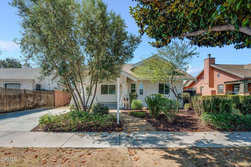 Set in the beautiful Vermont Square neighborhood at the vibrant heart of Los Angeles, this home and its permitted Accessory Dwelling Unit (ADU) create the perfect blend of city living and serene retreat. The exquisitely designed main house, equipped with modern appliances and recent updates, offers spacious living that's both stylish and functional. In the front yard, a stunning butterfly garden creates a peaceful outdoor retreat. Landscaping here features a drought-tolerant low water irrigation system. The spacious backyard adds yet another beautiful setting. Adorned with fruit trees and a wonderful grassy area, it's an ideal place for relaxation and family gatherings. A thoughtfully designed ADU complements the main house, ensuring a cohesive feel throughout the property. Built in 2022 and fully permitted, this separate 400-square-foot suite ensures privacy and the potential for rental income or space for family or guests. The unit has a kitchen, a full bath and new appliances including washer and dryer. Other amenities include a new driveway for parking and a spacious storage shed. The address is near several LAUSD schools, making it an ideal choice for families. Nearby schools include Menlo Avenue Elementary, Normandie Avenue Elementary, Lou Dantzler Preparatory Charter Middle School, and Manual Arts Senior High School. The home is also walking distance from the Vermont Square Library and Vermont Square Park. Strategically located near the University of Southern California (USC), this property is well-positioned to benefit from the area's ongoing growth, especially in view of the upcoming Olympic Games and the FIFA World Cup. A major price reduction and a motivated seller make it a uniquely attractive investment opportunity.