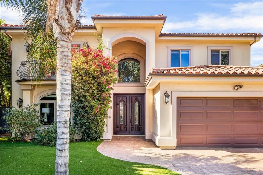 Stunning Mediterranean retreat in the heart of Encino’s most coveted tree-lined enclave. Set on an expansive 10,000+ sq ft lot, this 5-bedroom, 4-bathroom estate offers over 4,300 sq ft of refined living space, blending timeless architectural details with modern luxury.

A dramatic double-height foyer with wrought iron accents and travertine floors sets the tone for the open, light-filled floor plan. Elegant formal living and dining rooms provide seamless flow for entertaining, while the spacious family room with fireplace opens through sliding glass doors to a lush, ultra-private backyard oasis. Outside, enjoy a sparkling pool, generous patio, and manicured grassy areas—perfect for both grand gatherings and intimate relaxation. The gourmet chef’s kitchen is a true centerpiece, featuring an oversized center island, stainless steel appliances, abundant cabinetry, and a sunlit breakfast nook. A versatile guest suite or home office with full bath completes the main level.

Upstairs, four bedrooms include the luxurious primary retreat with two oversized walk-in closets and a spa-inspired bath boasting dual vanities, soaking tub, and separate shower. Additional highlights include a dedicated laundry room, custom finishes throughout, and an attached two-car  garage. Located just moments from Ventura Boulevard’s premier dining, shopping, and cafes—with effortless access to the 101 and 405 freeways—this turn-key estate delivers the perfect blend of elegance, privacy, and convenience.
