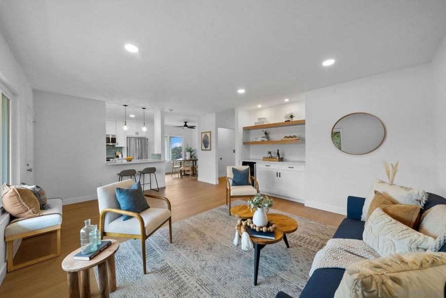 Check out this fully renovated top floor corner unit with views to Mission Bay @ Mission Bay Condos! First time on market since 1990. Step into coastal inspired design flooded with natural light with this west facing 2bed 2bath 1,102sqft single level unit just steps from the elevator. New LVP light oak flooring throughout, open floor plan, newly remodeled kitchen with smart design inc Kraus workstation sink, blind corner pull out, pantry cabinet, corner upper cabinets, ceramic tile backsplash, quartz counters, breakfast bar, recessed lighting, & LG suite of SS appliances inc french door fridge, electric stove w/airfryer & convection cooking. Peek a boo views from dining area. Well sized living room with built in cabinetry & wine fridge, recessed lighting, & new wall A/C unit. Remodeled baths include tiled shower/bath enclosures with Santa Margarita Hexagon tiles, new vanities, & fixtures. Primary bedroom features ensuite bathroom, walk in closet, & balcony to enjoy SW facing views to Mission Bay, SeaWorld Fireworks & stunning sunsets. Laundry closet in unit with space for side by side W/D & storage. New dual pane windows & slider. 2 assigned parking spaces, 1 covered carport w/storage cabinet & 1 assigned space close to elevator. Only 1 shared wall being a corner unit & no unit above. HOA is $544.50/month included water, trash, termite, common area, & exterior building maintenance. Complex amenities inc: gated complex, pool, spa, BBQ area, elevators, pet friendly 2 pets up to 30lbs each.  Central location in the heart of Bay Park. Close proximity to Mission Bay, Fiesta Island w/dog park, local beaches inc OB, Mission & PB, Tecolote Canyon park, USD, restaurants like The High Dive on the corner, Bay Park Fish Co, Tio Leo's, & shops. Nearby public transit inc Tecolote Station on SD Trolley Blue line providing a short ride to UCSD/UTC, Old Town, Downtown SD/Airport. Easy access to freeways 8,5 & 163. Over $100K in renovations approved by the HOA & work done by a licensed G/C.