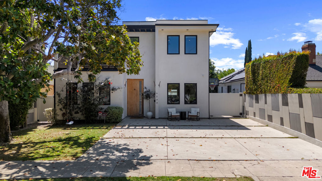 Stunning Contemporary in Studio City. Welcome to 4299 Elmer Ave, Built in 2020, a 5-bedroom, 5-bathroom contemporary home located in the heart of Studio City's desirable Tujunga Village neighborhood. This two-story residence offers over 3,682 sq ft of thoughtfully designed living space with modern finishes throughout.The main level features engineered hardwood floors, an open-concept living and dining area, and a gourmet kitchen with custom cabinetry, high-end appliances, a large center island, and a built-in dry bar. A spacious primary suite is conveniently located on the first floor, complete with a walk-in closet and ensuite bathroom.Upstairs, you'll find an additional primary suite with a double vanity, designer tile, and walk-in shower, along with generously sized secondary bedrooms and bathrooms.The private backyard is ideal for entertaining, featuring a heated pool and spa, surrounded by lush landscaping. The detached garage has been converted into a versatile finished spaceperfect for a home office, studio, or guest room.Additional features include central HVAC, recessed lighting, upstairs laundry, and a gated front entry. Located just moments from shopping, dining, and parks, this move-in-ready home offers comfort, luxury, and convenience in one of Studio City's most charming neighborhoods. --- The garage was converted to livable space and is included in the total square footage.