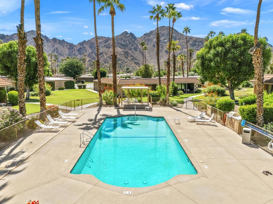 Wonderful curb appeal, awesome pool, and mountain views plus spacious surrounding green belt this inviting 3 bedroom, 2 bath, 2 car plus golf cart with epoxy flooring garage, furnished Sandpiper Condo located in prestigious guard gated Indian Wells Country Club is hard to beat! From the French door entry this 1845 Sq.Ft. Condo built in 1972 has modern decor with travertine floors, neutral carpet in 2 bedrooms, modern ceiling fans, and fixtures. The open Great Room with high ceilings has electric fireplace and walls of glass sliders which lead out to large, tiled patio featuring panoramic mountain views. Open Kitchen has stainless appliances including a wine cooler, neutral Corian counters, bar seating, white cabinetry, and glass tiled backsplash. Primary Bedroom Suite has beautiful west mountain views, dual sinks, neutral tiled shower, and custom walk-in closet. Two Guest Bedrooms share a full bath with shower and a private large, tiled atrium for enjoying the desert sunshine. One Guest Bedroom made into a spacious home office. Laundry closet has storage cabinets.