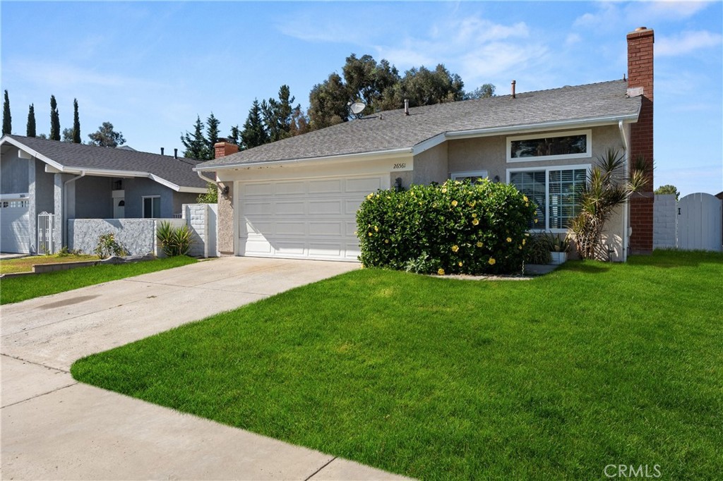 Welcome to this stunning two-story, 4-bedroom home, offering breathtaking panoramic city light and mountain views! Located in the highly desirable Barcelona tract of Mission Viejo, this property is perfectly positioned on a quiet, interior street. As you enter, you are greeted by a welcoming living room featuring soaring vaulted ceilings and a charming fireplace, creating the perfect ambiance for relaxation and gatherings.The main level is highlighted by the spacious Primary Bedroom suite, complete with sliding glass doors that provide seamless access to the beautifully landscaped backyard—ideal for enjoying serene mornings and picturesque evenings. The adjacent kitchen is light and bright, featuring a cozy dining nook bathed in natural sunlight, making it an inviting space for everyday meals and entertaining.Upstairs, you’ll find three additional bedrooms, each equipped with ceiling fans. These rooms share a well-appointed full bathroom, ensuring comfort and convenience for family and guests alike.This home is ideally located just moments away from shopping, top-rated schools, parks, restaurants, and the renowned Lake Mission Viejo, where you can enjoy boating, fishing, and year-round community events. Don’t miss the opportunity to make this exceptional property your new home!