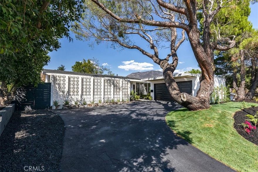 GREAT VIEWS IN THE SAN FERNANDO VALLEY!!! Welcome to a peaceful 4-bedroom, 2-bathroom hillside retreat in the scenic and prestigious Crystal View neighborhood of Tujunga. Completely remodeled this home features a new roof, new windows, a new electrical Panel and a new water heater--every detail thoughtfully updated. This home is perfectly perched to capture breathtaking mountain views...Inside, expansive picture windows flood the open-concept layout with natural light. The open-concept design flows into a chef's kitchen with quartz countertops, custom cabinetry, stainless steel appliances, and an island perfect for entertaining. The updated kitchen and bathrooms are equally refined, with new finish and fixtures throughout...Step outside to your private backyard oasis, with a sun-drenched patio, and mature trees await. Enjoy your morning coffee or sunset while taking in panoramic mountain views--all with no freeway noise, a rare luxury for view homes in the area. Additional highlights include multiple outdoor living spaces, an attached 2-car garage, and close access to hiking trails. This one-of-a-kind property offers the ultimate blend of comfort, nature, and refined California living.