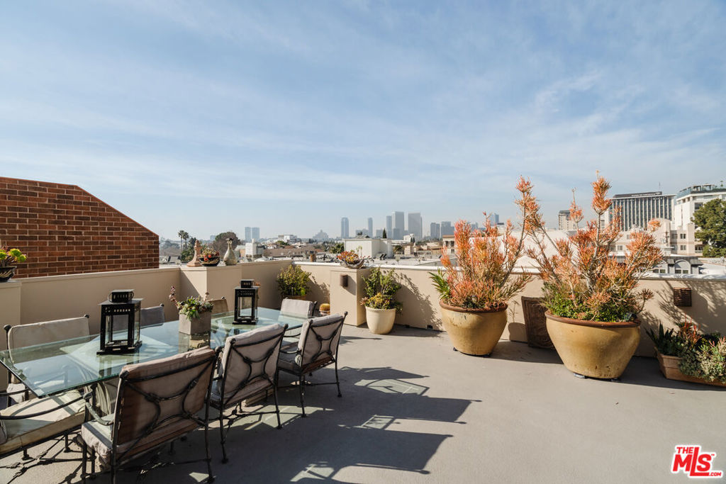 Stunning Two-Story Mediterranean Penthouse located in the heart of Beverly Hills, close to all the incredible restaurants, shopping and businesses that downtown Beverly Hills offers. Enter the fully furnished, spacious home via private elevator direct access to double height ceilings, tile and hardwood flooring, beautiful moldings and lots of light. The main floor includes an open Living Room and dining area with Romeo and Juliet style balcony, an intimate family room/Den with a full bar and sink, large kitchen with center island, stainless steel appliances and breakfast area, two guest bedrooms with full bathroom, Powder Room, and washer/dryer. Upstairs is a balcony overlooking the Living Room and leading to a massive private roof-top patio with amazing, picturesque views. Also, upstairs is the Primary suite with fireplace, walk in closet, and large bathroom featuring a spa tub and double sinks. Building is secure with coded entry, garage parking with 3 side by side spaces and guest parking. Offered fully furnished with linens, towels, dishes.