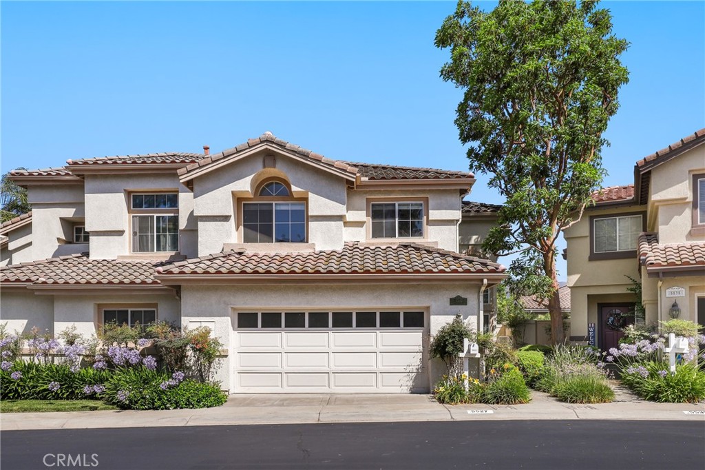 Welcome to 5527 Patricia Way, a beautifully updated home nestled in the highly desirable La Terraza community of Yorba Linda. This light-filled residence offers an inviting sense of space, with rainbows dancing throughout the day thanks to thoughtfully placed windows and decorative glass light fixtures. The open and airy floor plan is enhanced by vaulted ceilings, excellent natural flow, and refreshing cross breezes. The formal living and dining rooms create an elegant setting for gatherings, while the cozy family room—with fireplace and direct access to a private, covered patio—is ideal for everyday comfort. Enjoy mountain views out back and peaceful privacy throughout. The updated kitchen features granite countertops, stainless steel appliances, and a reverse osmosis water filter, all opening to a casual dining area that flows seamlessly into the family room. Downstairs includes a guest powder room, an interior laundry room, and direct access to the attached two-car garage. Upstairs, the primary suite is a tranquil retreat with vaulted ceilings, stylish ceiling fan, mountain views, and a spa-like ensuite bathroom featuring an oversized soaking tub, separate walk-in shower, dual vanities, and a generous walk-in closet. Two additional bedrooms and a pristine hall bath with dual sinks complete the upper level. Upgraded tile and genuine hardwood floors run throughout the home, complemented by modernized stair railings and lighting fixtures. Additional premium upgrades include a brand-new HVAC system, Halo 5 whole-house water filtration and conditioning, all new plumbing, and custom top-down bottom-up window treatments. La Terraza offers resort-style amenities with two sparkling pools, two spas, and a versatile sport court for tennis, pickleball, or basketball. Enjoy direct access to nearby walking and biking trails, Bryant Ranch Park, and top-rated schools including Bryant Ranch Elementary, Travis Ranch Middle, and Yorba Linda High. This is the one you’ve been waiting for—comfort, style, and a vibrant community in Yorba Linda.