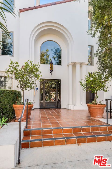 Photo of 10648 Woodbridge Street #306, Toluca Lake, CA 91602 (MLS # 26671777)