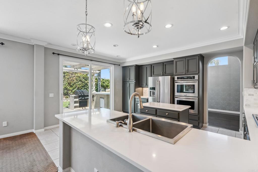 Welcome to 6618 Vireo Court in the charming and sought after Aviara neighborhood of Carlsbad! This inviting 4-bedroom, 3.5-bathroom home offers 2,470 square feet of comfortable living space, perfectly designed for a family or those seeking both beauty and functionality. This home features quality finishes, soaring ceilings, a downstairs bedroom w/ full bathroom, spacious living room, separate dining room, charming powder room, & cozy family room. The beautiful kitchen has quartz counters, marble back splash, & stainless appliances. The spacious primary bedroom has a stunning, remodeled ensuite bathroom and large walk-in closet. Two additional bedrooms can be found upstairs and feature a Jack & Jill bathroom and built in cabinetry. Laundry will be a breeze with the top of the line LG washer & Dryer, folding counter, and wash basin. Stay cool in the summertime with the newly installed central air conditioning and enjoy the efficiency of the tankless water heater. This home is located on a corner lot of a lovely cul-de-sac. The 3-car garage offers plenty of space for your vehicles and additional room for extra storage. The chest freezer will remain in the garage; perfect for stocking up! The expansive back yard has a built in kitchen area featuring a dual tank-propane BBQ and mini fridge. Relax under the pergola to the sounds of running water and dine al fresco enjoying the patio furniture which all conveys with the house! This neighborhood is zoned for the highly rated Carlsbad school district. Aviara Oaks Elementary, Aviara Oaks Middle School & Sage Creek High School. *small pets negotiable with additional deposit and/or rent* First Showings at Open House This Saturday between 10am-1pm