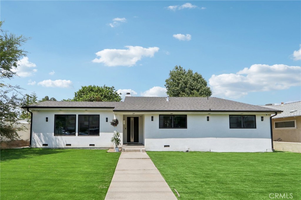 Beautifully remodeled home located in Granada Hills. Seller spent thousands of $$$’s on this Stunner!! Situated on a spacious 7,800 sqft lot, this 1,780 sqft 3 bed, 2-bath home offers impressive curb appeal with a modern black-and-white exterior, a stylish front door, and new artificial grass that stays green year-round. Step inside to find luxurious flooring throughout, a formal dining area with a custom accent wall, sleek fireplace, and designer raised ceilings. The open-concept chef’s kitchen is equipped with stainless steel appliances and a central island that opens seamlessly to the spacious family room with built-in speakers and a modern fireplace—perfect for entertaining. The primary suite includes a beautifully remodeled en-suite bathroom with dual vanity and walk-in shower, while two additional bedrooms share an updated full bath. Outside, enjoy a covered patio with recessed lighting and built-in speakers, a large backyard for gatherings, and a detached garage with alley access—ideal for an ADU (buyer to verify). There’s an extra storage structure for added convenience. Located near shopping centers with easy freeway access, this turnkey home truly has it all. Don’t miss your chance to make it yours!