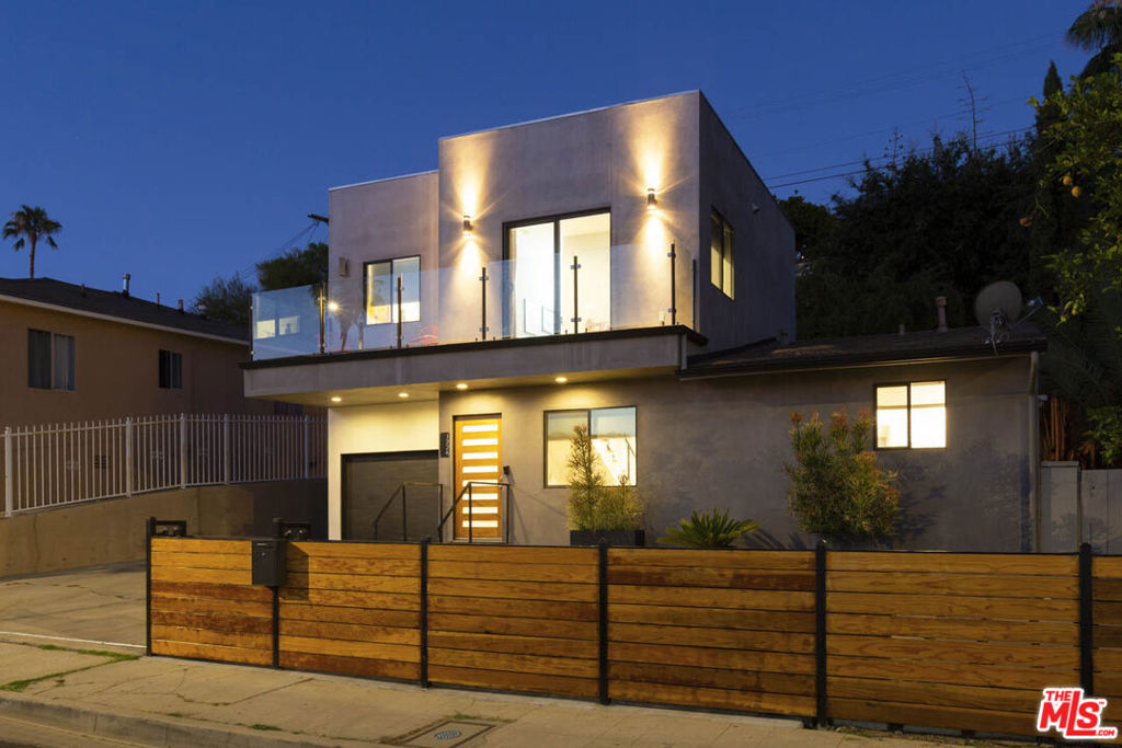 This property qualifies for the Ladder Up Grant Program through City National Bank, offering up to $20,000 that may be applied toward a buyer's down payment, closing costs, or interest rate buy-down. A rare opportunity to pair financial assistance with a one-of-a-kind hilltop home in Boyle Heights. Perched atop City Terrace, this updated 2-bedroom + den, 2-bathroom residence delivers sweeping, unobstructed views of the Downtown Los Angeles skyline. Offering 1,498 sq ft of thoughtfully designed living space, the home blends timeless charm with modern upgrades. The flexible den provides options to serve as a third bedroom, home office, guest room, or creative space. The upstairs primary suite added in 2017/2018is a true highlight, offering privacy, comfort, and a balcony with panoramic city views. Inside, natural light enhances the open layout, with features that include central A/C, updated copper plumbing, a newer electrical panel, dual laundry hook-ups (both upstairs and in the garage), and a fully remodeled bathroom completed in 2023 with contemporary finishes. Curb appeal shines with a sleek wood-and-metal fence, automatic gate, newer pavers, and drought-tolerant landscaping. The private backyard is equally impressive, featuring slate-stamped concrete, a rebuilt retaining wall, and an urban orchard with mature fruit trees peach, loquat, orange, lemon, and pomegranate. Additional amenities include a one-car attached garage, four uncovered parking spaces, a storage shed, and a rain barrel for sustainable living. Located just minutes from Downtown LA, the home offers not only breathtaking views but also the best of Boyle Heights: a strong sense of community, vibrant murals, local eateries, and a thriving creative culture. With modern amenities, historic soul, and a financial boost to help make it yours, this City Terrace gem is move-in ready and waiting. Don't miss this rare opportunity schedule your private showing today.