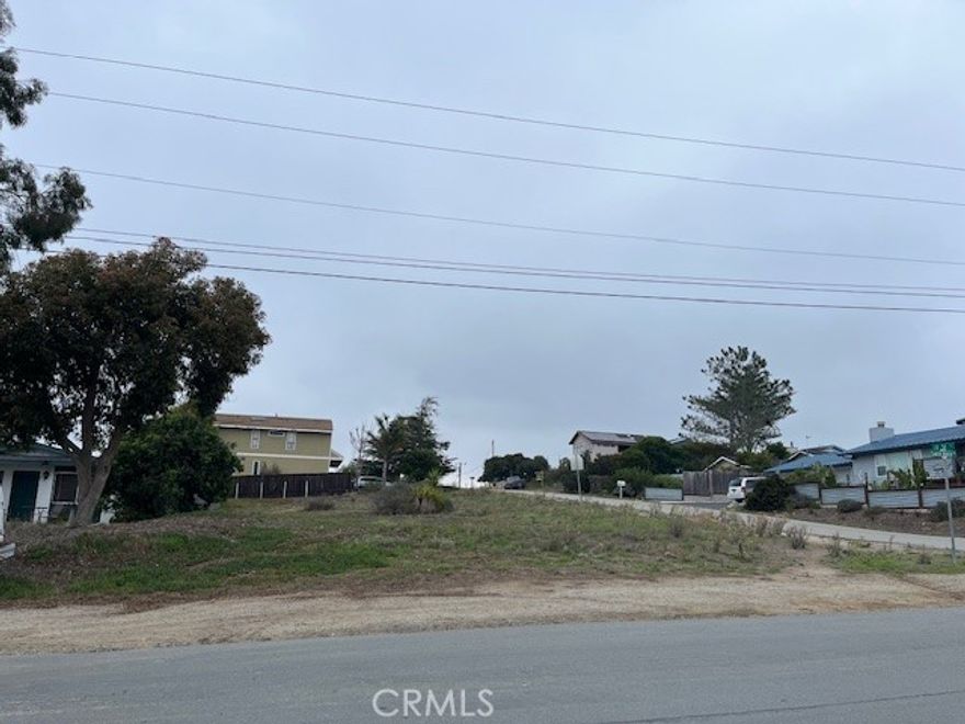This highly desirable lot is a gently sloping corner lot in an established Los Osos neighborhood with paved streets across from Baywood Elementary School.  It is #83 on the SLO County water wait list for Los Osos. Possible water views from a second story.  Lot is 6250 sq.ft.  It is located just blocks from the bay and has close proximity to Baywood with its popular restaurants and the Monday Farmer's Market.  Check with the SLO County Planning and Building Department to verify the possibility of building.