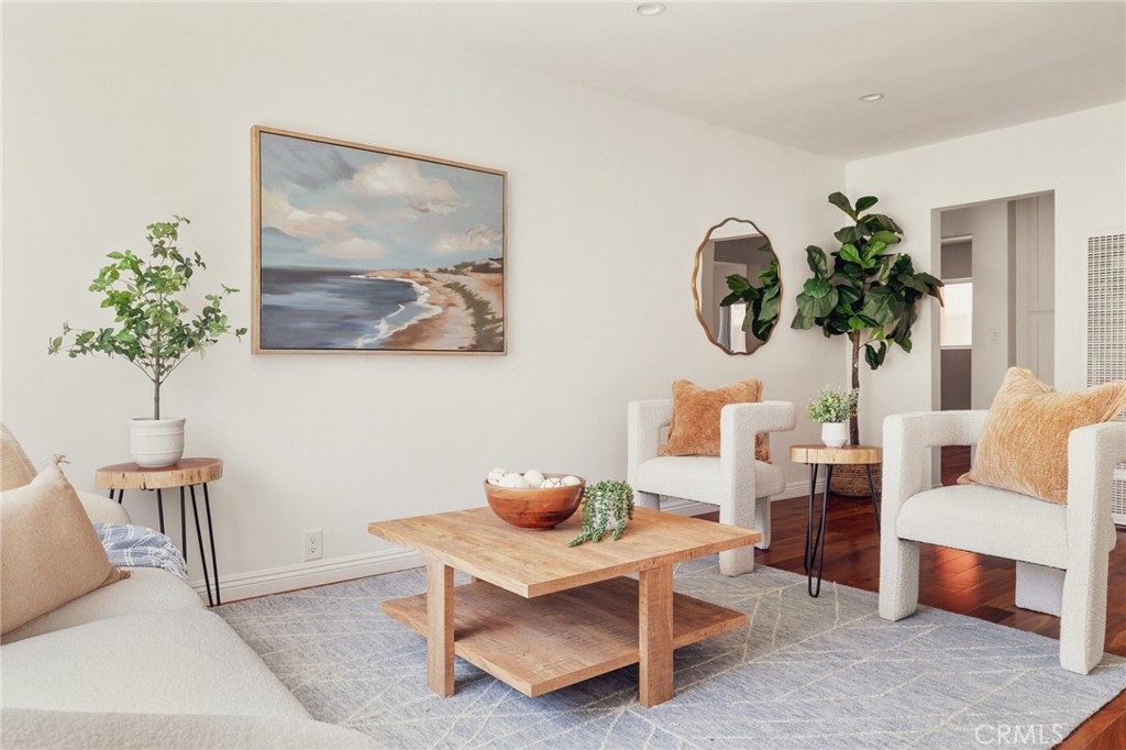 Nestled in the beating heart of Santa Monica, on the border of Sunset Park and Pico, 1918 11th Street #D is a beautifully updated 2-bedroom, 2-bath residence just 10 blocks from the beach. Offering 923 sq ft of well-designed living space, the home welcomes you with hardwood floors, an updated kitchen with newer appliances and reverse osmosis system, and a bonus laundry room with newer washer/dryer. Both bedrooms are enhanced with blackout blinds, creating peaceful retreats in the heart of the city. Thoughtful updates include a modern electrical panel, newer water heater, and a roof recently completed by the HOA with no current assessments. Set within an intimate 7-residence community, this home provides two side-by-side parking spaces and a boutique sense of privacy. Positioned in a sought-after Santa Monica enclave, just moments from schools, shopping, dining, and the beach, this residence offers the perfect balance of coastal charm, modern comfort, and everyday convenience - an ideal opportunity to enjoy Santa Monica living at its finest.