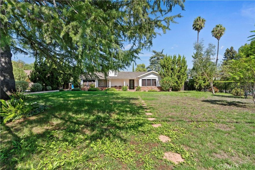 Turnkey Gated Estate in Coveted Walnut Acres.
Welcome to this beautifully updated home, privately gated and ideally located in the highly desired Walnut Acres neighborhood. 
Nestled on nearly half an acre of flat, usable land, this property offers the perfect blend of comfort, privacy, and luxury living.
Step inside to discover a bright, open floor plan with modern finishes, spacious living areas, and seamless indoor-outdoor flow. 
The expansive grounds provide endless possibilities - from entertaining and outdoor dining to adding a pool, guest house, or ADU.
Enjoy the peaceful atmosphere of Walnut Acres while being just moments away from top-rated schools, shopping, dining, and the best of Woodland Hills living. Turnkey. Gated. Prime Location. This exceptional property truly has it all.