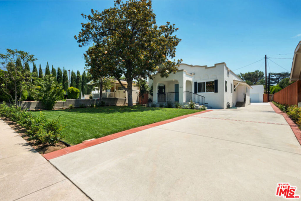 Beautifully remodeled 3 + 2 Mission Revival Bungalow "mini-estate" in the fantastic area of NE Pasadena right near Washington and Hill Ave! Clean modern finishes, grassy yards and gated large lot make this a perfect home. Open concept floor plan through living room, dining room and kitchen. Stunning new hardwood style floors throughout. Living room features charming built ins and decorative fireplace. Kitchen has stunning layout with new white cabinetry, quartz countertops, breakfast bar, subway tile backsplash, stainless steel six burner gas stove, refrigerator and dishwasher. Enormous master with vaulted ceilings and en-suite bath. Bedrooms are spacious and both back bedrooms open up to back patio and large grassy yard beyond. New central air and heat. Laundry Room has full size washer/dryer and service entrance. Two car garage is finished and there is plentiful gated driveway parking. Wonderful area with a walkscore of 85! Friendly pets ok. Available now.